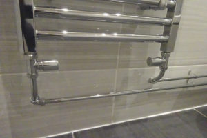 Towel warmer with chrome heating pipes