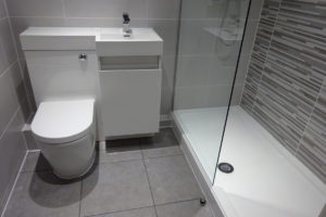 Shower room Warwick with combined vanity toilet storage unit