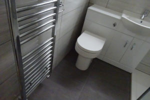 Mobility Bathroom with wall mounted Chrome towel warmer
