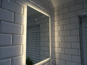 Modern bathroom led mirror on metro tiles