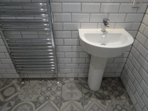 Shower Room with modern pedestal basin metro tiles
