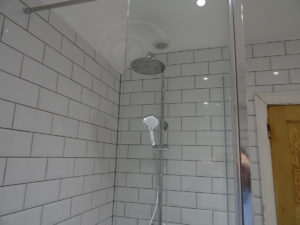 Thermostatic shower with metro bathroom tiles