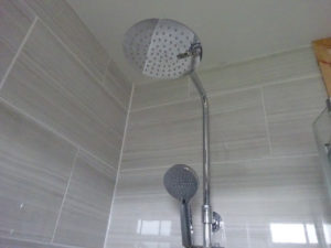 Tiled shower room with thermostatic shower