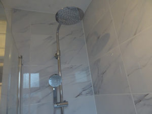 Bathroom with chrome thermostatic shower