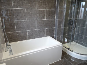Bathroom with bath and separate quadrant shower