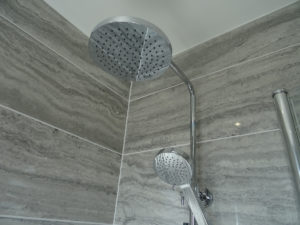 Fully tiled bathroom with thermostatic shower