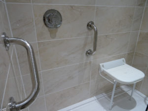 Mobility Shower with hand rails and shower seat