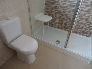 Mobility bathroom with comfort height toilet