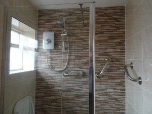 Mobility bathroom with feature tiled wall