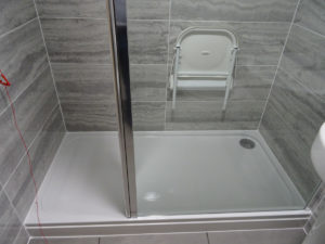 Mobility Shower Room with wall mounted shower seat Folded Up