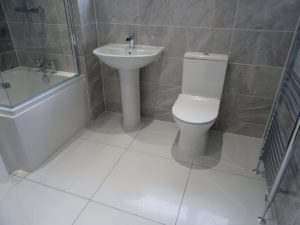 Fuly Tiled Bathroom walls and Floor with Grey Ceramic Tiles