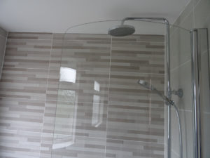 Featured tiled wall in a new fitted bathroom Ansley Nuneaton