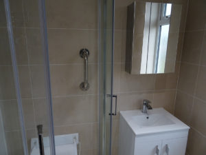 Coventry mobility shower room with wall fixed grab hand rails