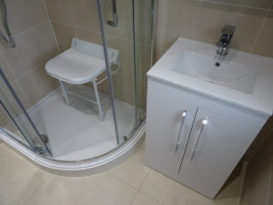 Coventry mobility shower room with wall mounted shower seat