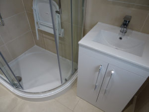Coventry mobility shower room with wall mounted shower seat