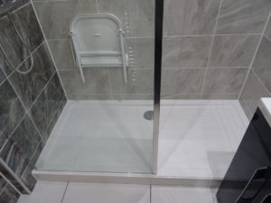 Mobility bathroom with wall mounted shower seat