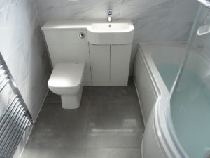Family Bathroom Coventry with P shaped shower bath and vanity basin toilet unit