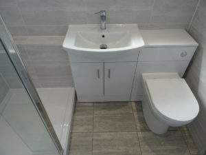 Mobility shower room Coventry with combined vanity basin and toilet unit