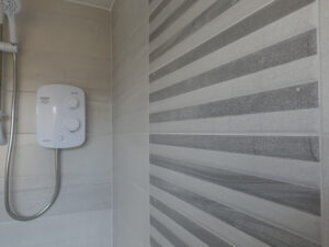 Walk In Shower Room With Feature Tiled Shower Wall
